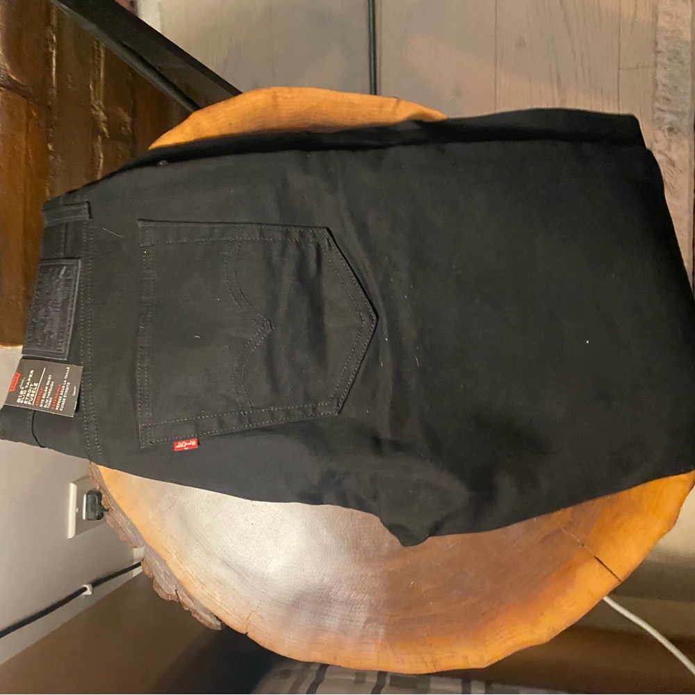 Levi's Men’s Black Slim Taper Jeans Sleek and Versatile - tags on